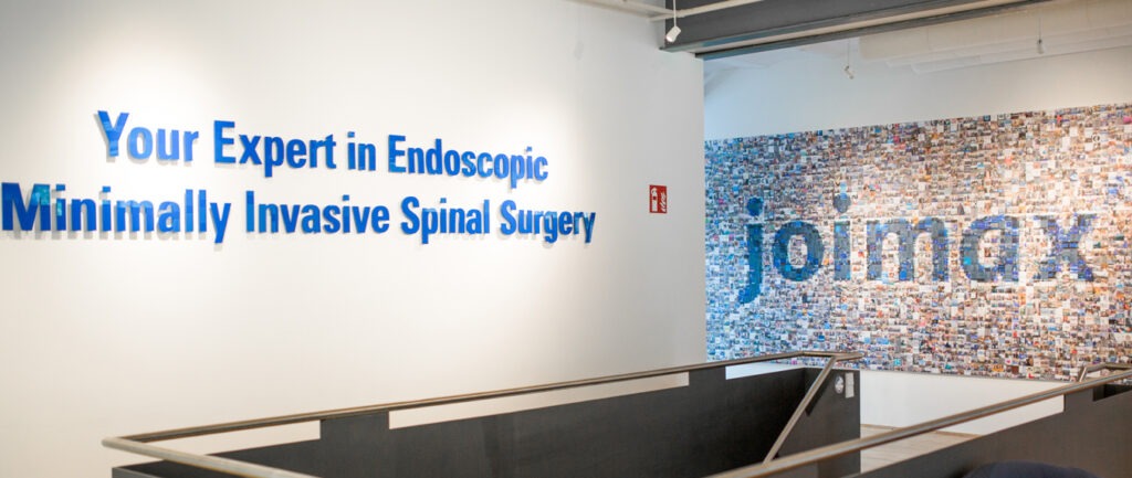 joimax Office Pictures with the slogan on the left wall "Your Expert in Endoscopic Minimally Invasive Spinal Surgery"